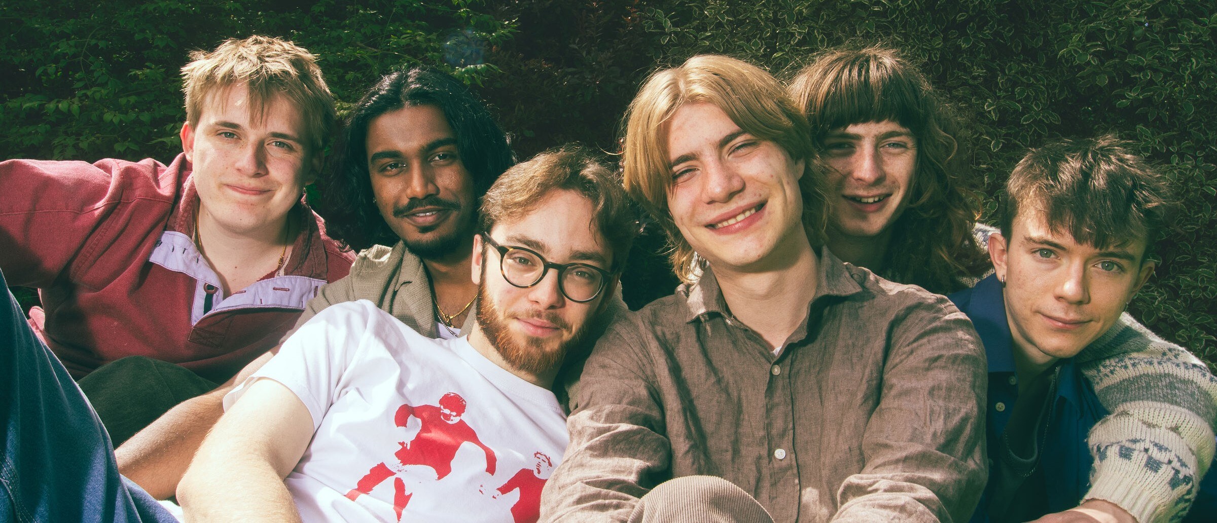 Happy Garden, the full six-piece band, portrait outdoors